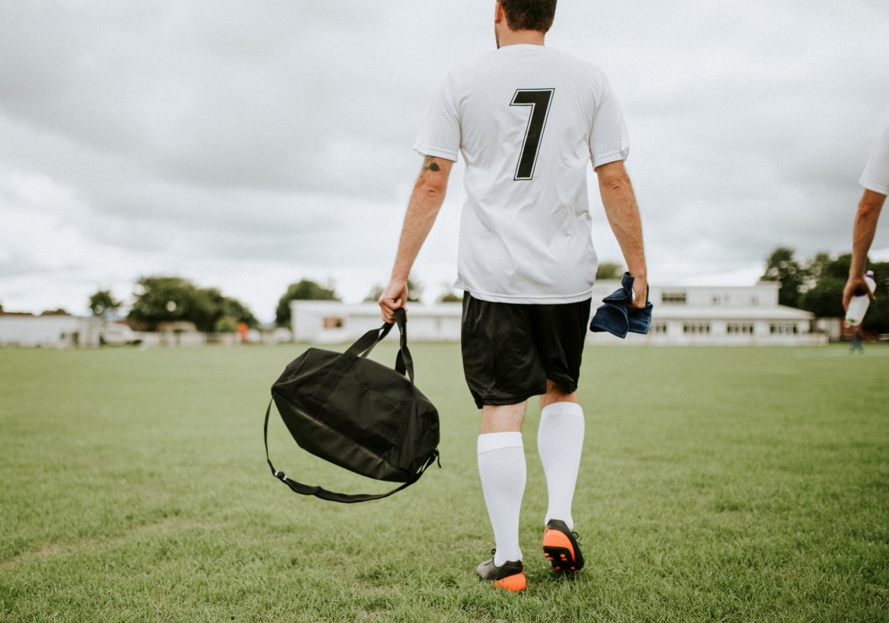 Football player taking bag to training