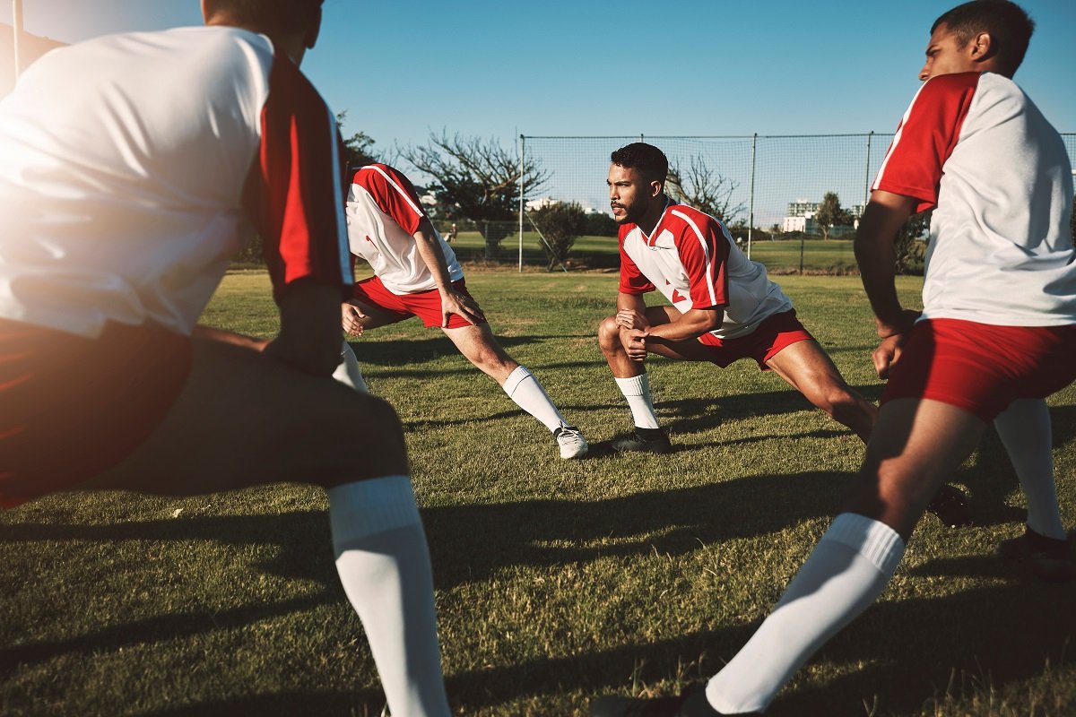 Football players stretching