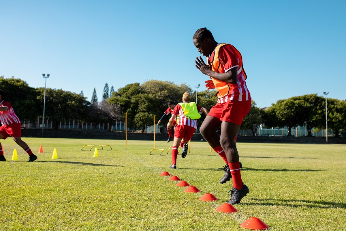 Footballer performing speed drills