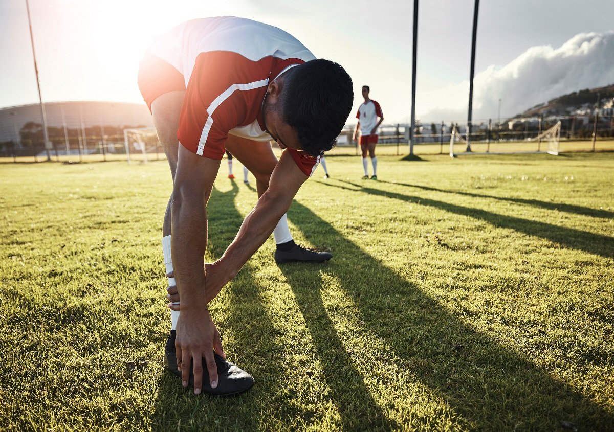 Footballer stretching