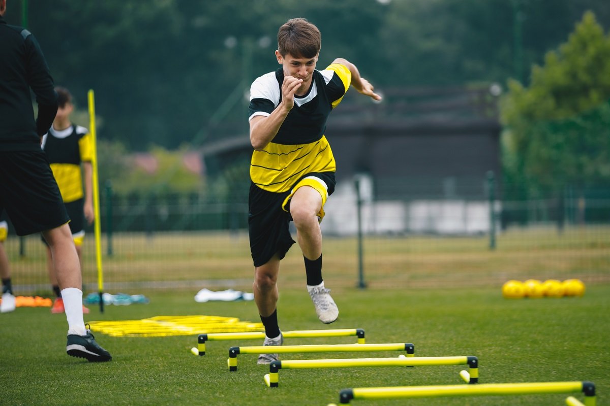 Footballer using speed ladder