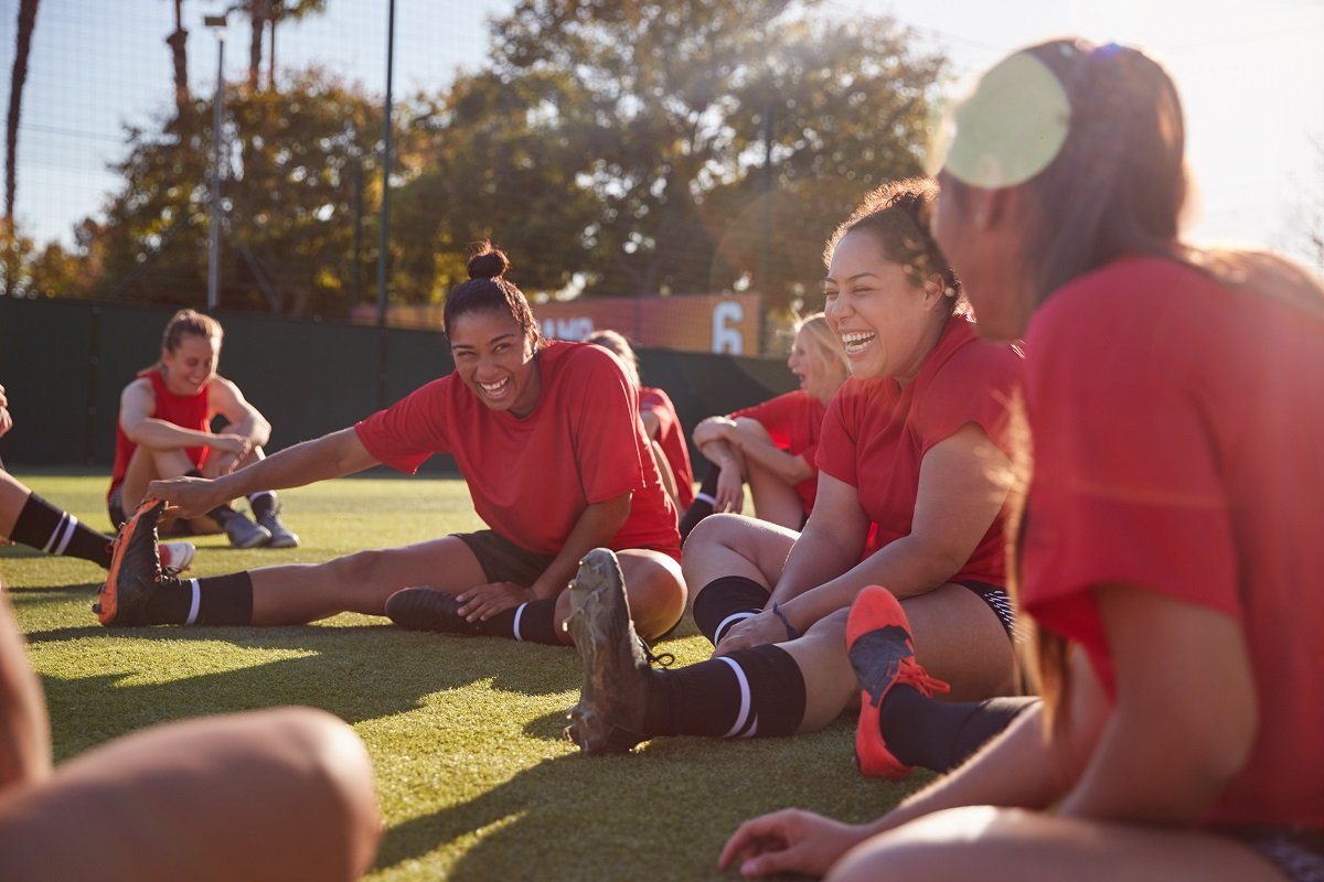 footballers stretching together