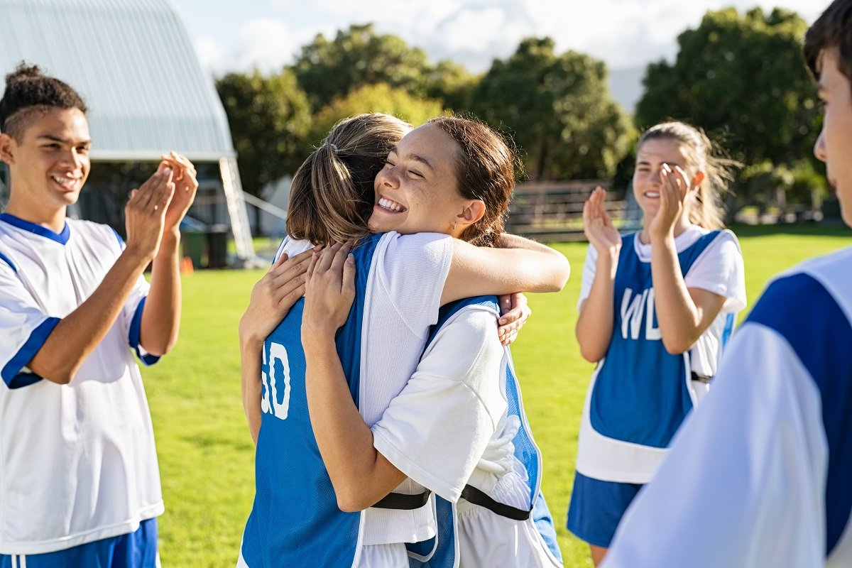 Happy teen football players