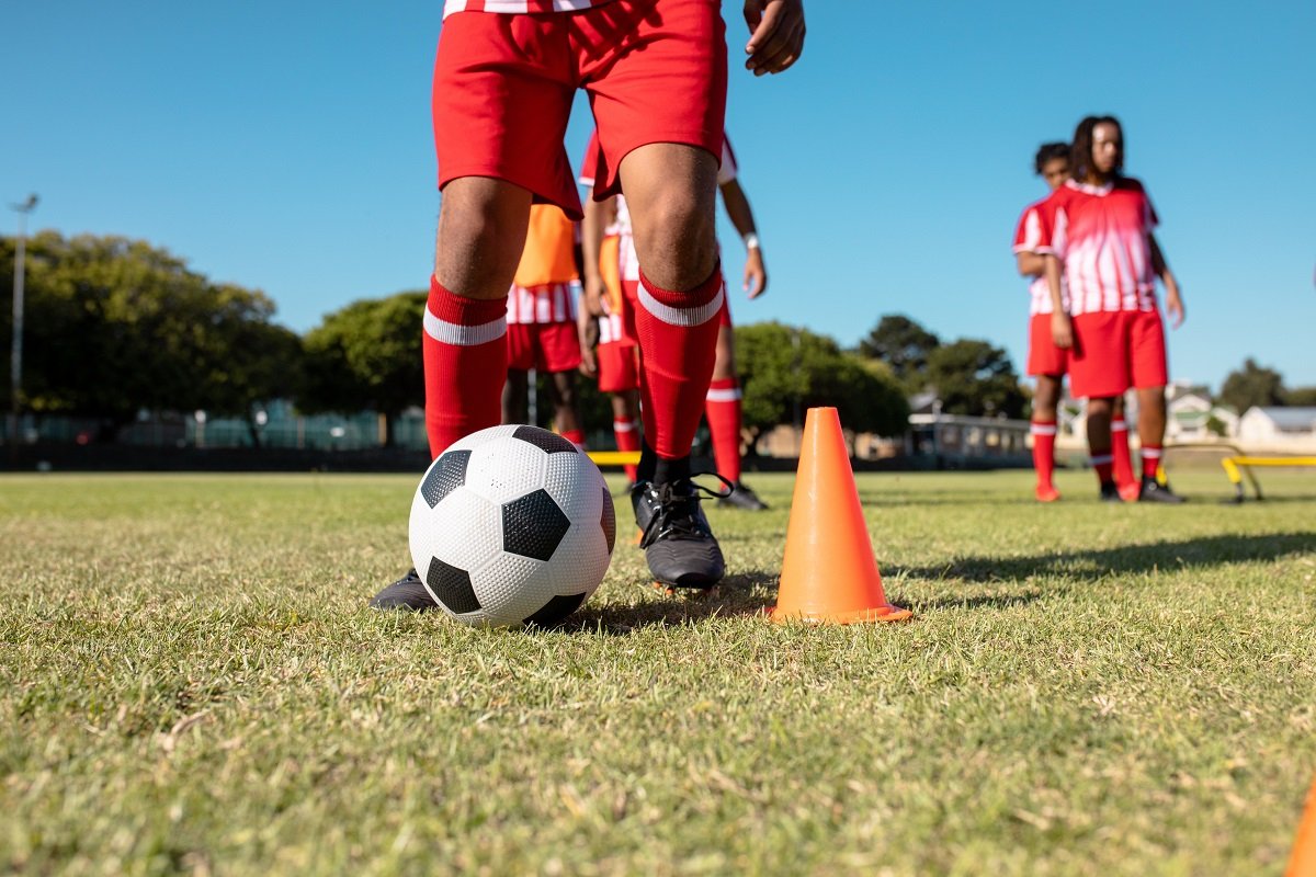 Players football training with cones