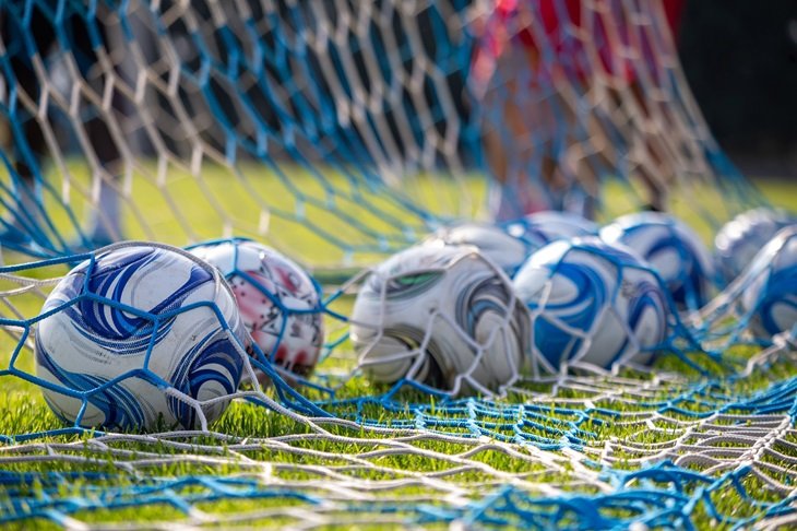 Footballs in the back of the net