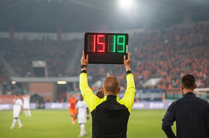 The fourth official holds up the substitution board