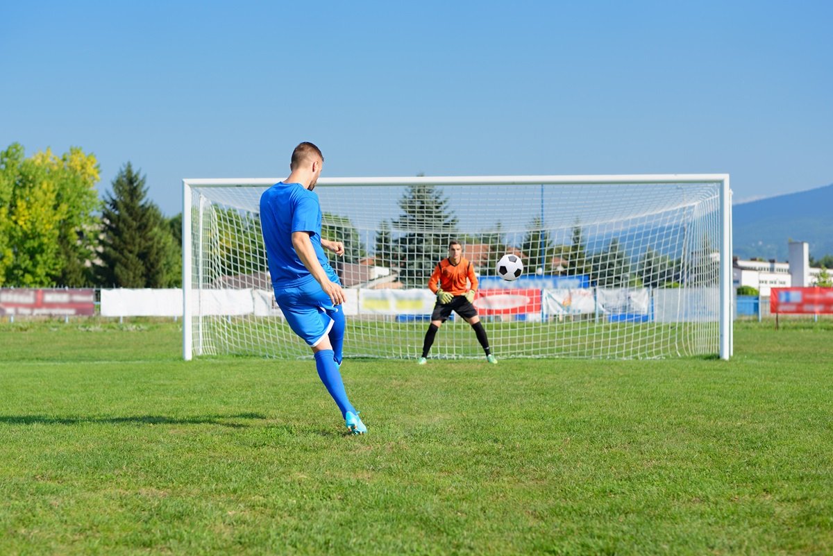 A player practices a penalty kick