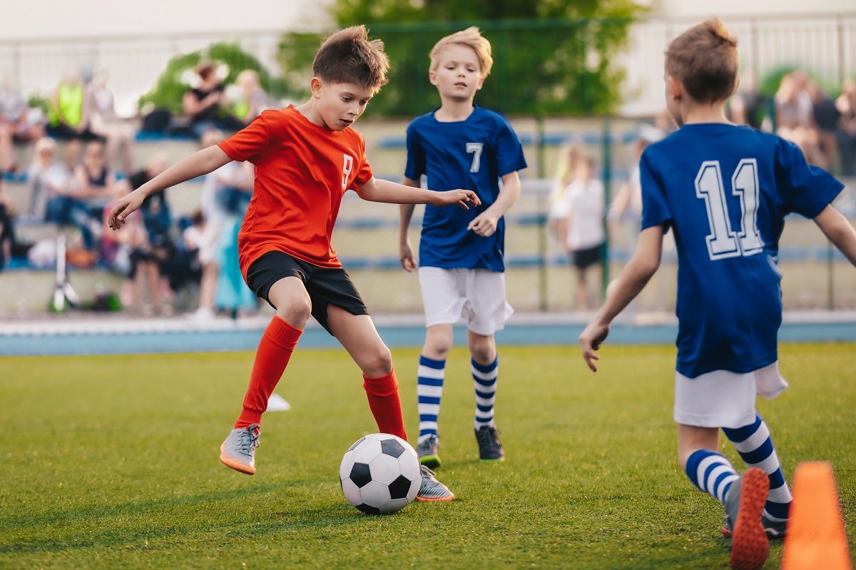 Young boys playing football